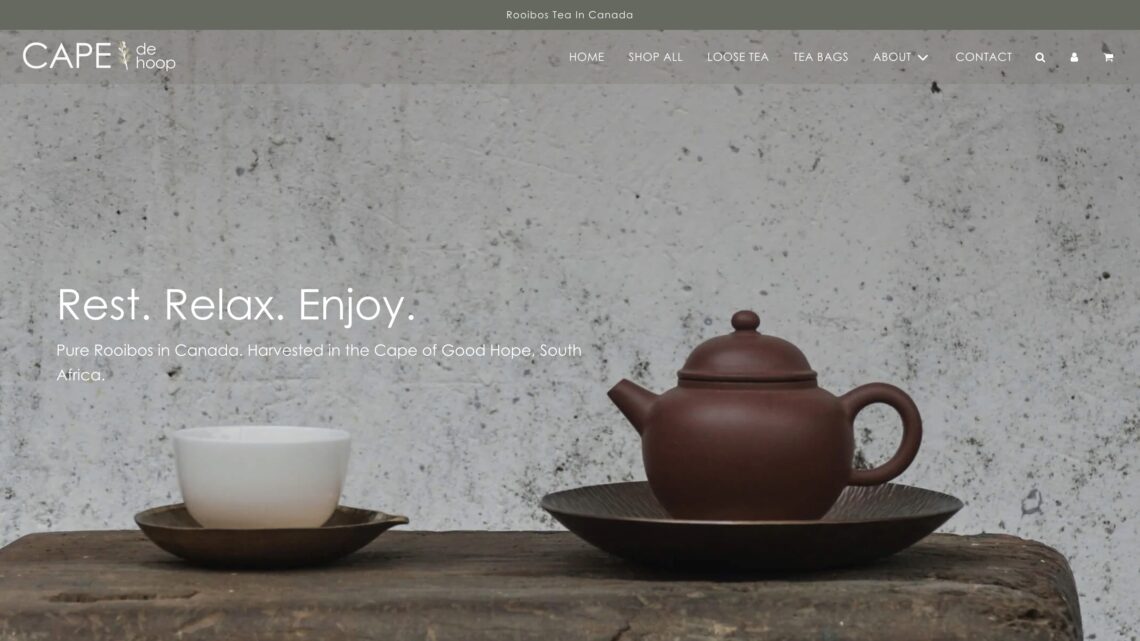 A screenshot of the Cape De Hoop website homepage with an elegant teapot and tea cup, built by the Kelowna web design and full service Marketing Agency called Navigator Multimedia.